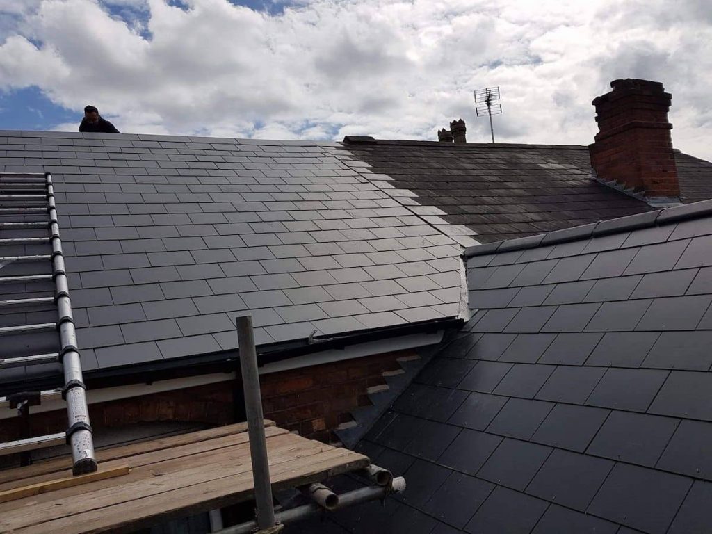 Roofers in Romford working on a slate roof replacement